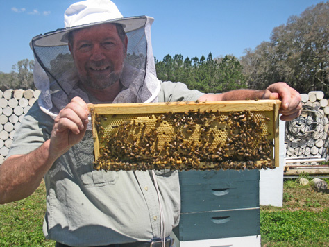 Chappie McChesney displays a small portion of his collection of honey bees